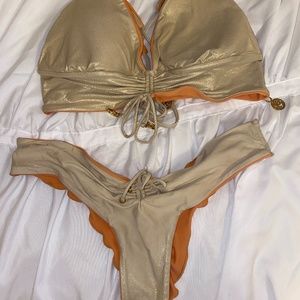 Reversible Luli Fama bikini with gold sparkles from everything but water